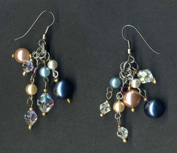Earrings made from faux pearl beads, crystal beads and seed beads recycled from thrift store jewelry.