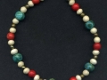 Turquoise, coral, and ivory colored ankle bracelet.