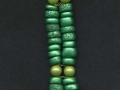 Double stranded bracelet made with polymer clay beads coated with Emerald PearlEx powder.