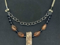 Necklace with rectangular sun pendant.
