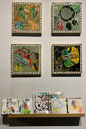 Four mixed-media collages and three art journals by Carolyn Hasenfratz Winkelmann displayed at the Back To Our Roots show.