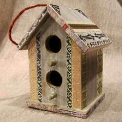 This decorative bird house was decoupaged with paper pieces, some rubber stamped with permanent ink.