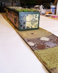 Table runner made from recycled upholstery samples to go with mixed media box.