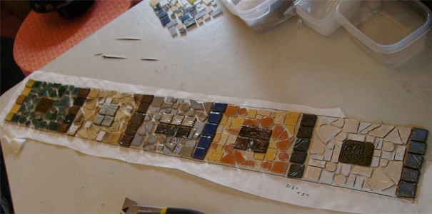 This picture shows tiles for a windowsill being laid out on paper. Some of these tiles I made, others were salvaged.