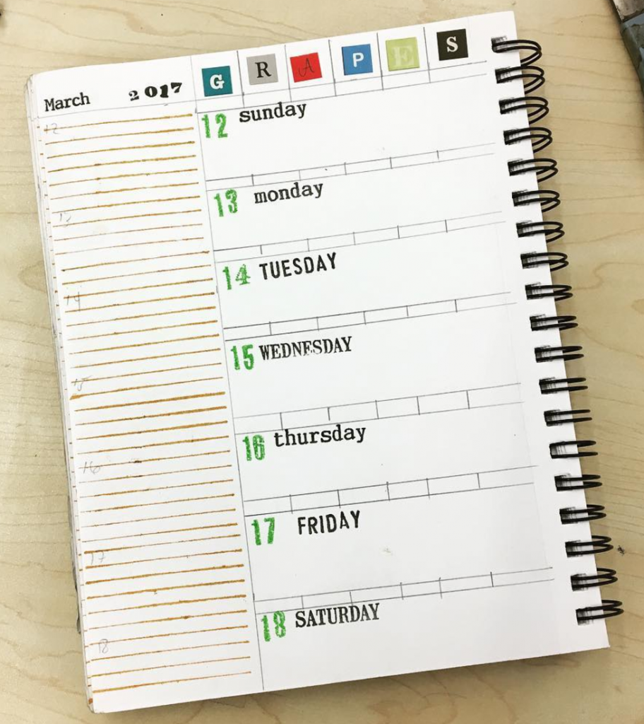 Planner page with rubber stamps and letter stickers