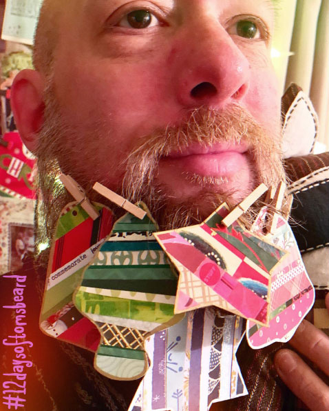 Tom wearing decorated shapes in his beard.