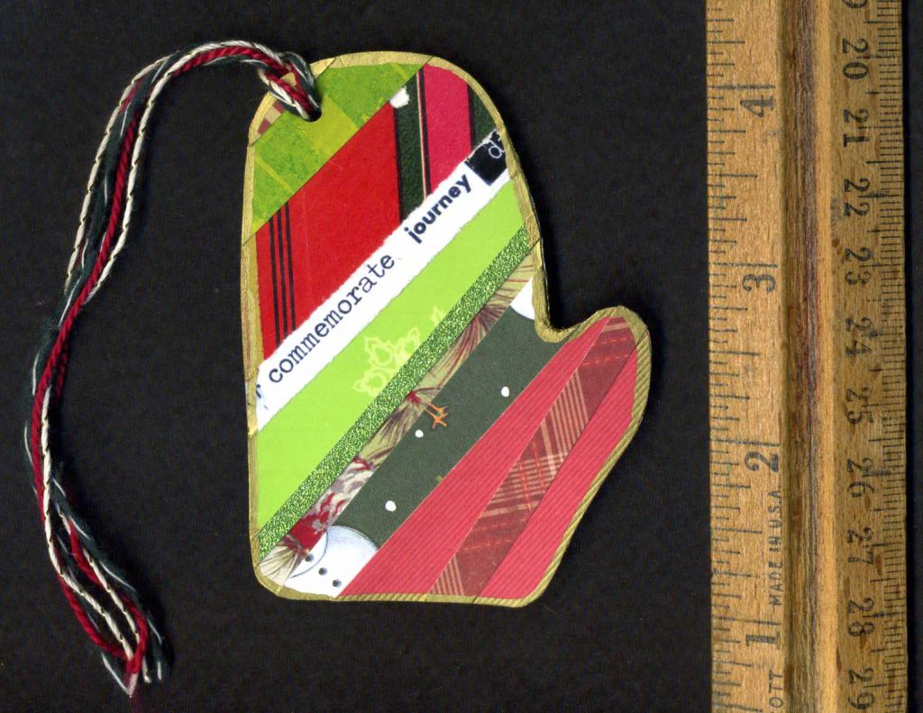 Handmade paper mitten-shaped bookmark.