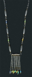 Necklace made from wire, metal beads and seed beads. Metal chain and some of the seed beads are recycled from thrift store jewelry.