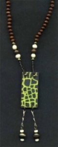 Necklace with lime green and black rectangular pendant.