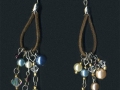 Earring findings, faux pearls, seed beads and crystal beads are recycled from thrift store jewelry.