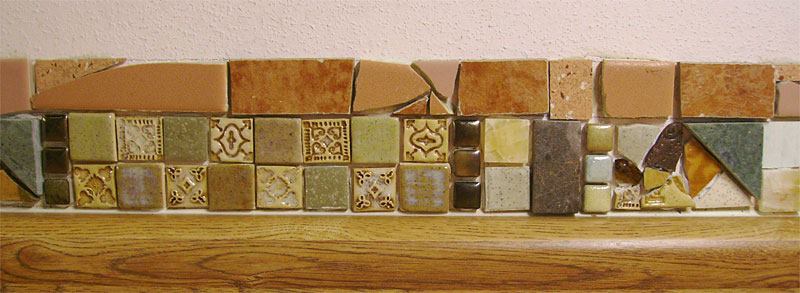I'm in the process of improving my kitchen backsplash with tile work. Here is a closeup showing some tiles I made and others I salvaged mixed with a few that I purchased.