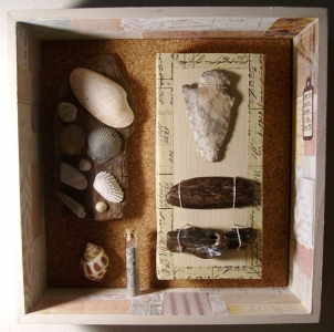 Here is a close-up of one of my shadow boxes that contains beachcombing finds. I found the spear point on a sandbar in the Mississippi River while on a float trip.