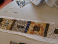 This picture shows tiles for a windowsill being laid out on paper. Some of these tiles I made, others were salvaged.